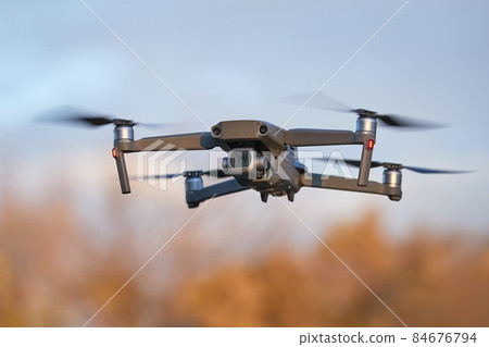Drone flying outdoors Drone flying outdoors 84676794