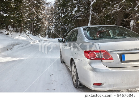 Winter driving on snow in mountains 84676843