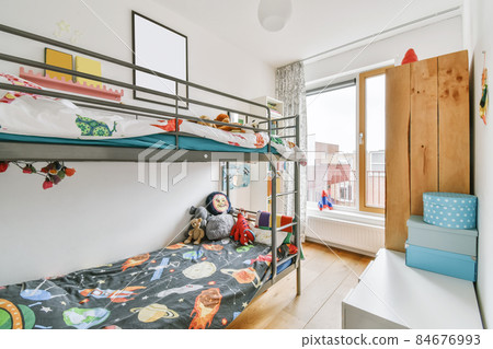 Stylish children's room with a bunk bed and paintings on the wall Stylish children's room with a bunk bed and paintings on the wall 84676993