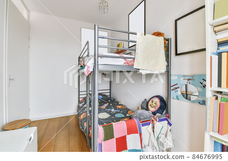 Stylish children's room with a bunk bed and paintings on the wall Stylish children's room with a bunk bed and paintings on the wall 84676995
