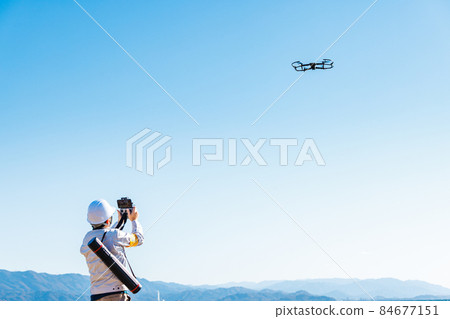 Workers operating drones 84677151