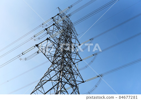 High voltage post, High voltage tower blue sky background, Electricity poles and electric power transmission lines against countryside High voltage post, High voltage tower blue sky background, Electricity poles and electric power transmission lines against countryside 84677281