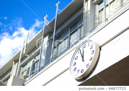 Blue sky, school building and clock Blue sky, school building and clock 84677725