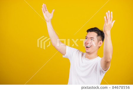 young man smile positive shaking hands enthusiastic shouting yes for win competition young man smile positive shaking hands enthusiastic shouting yes for win competition 84678556