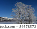 Hakuba village on a sunny winter, hoarfrost and Shirouma Sanzan 84678572