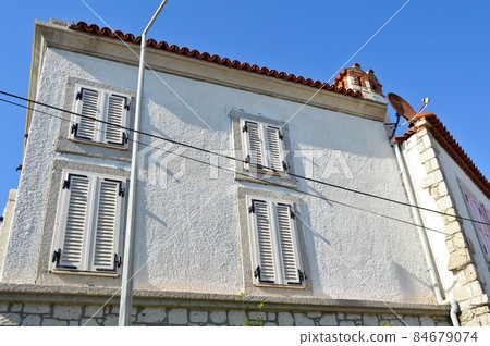 Cesme Alacati located in old antique house white wooden windows and shutters, Turkey Izmir Cesme Alacati located in old antique house white wooden windows and shutters, Turkey Izmir 84679074