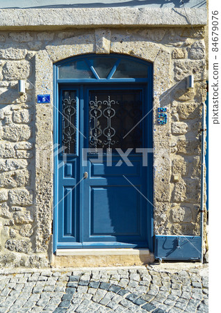 Decorative entrance wooden blue door of a nostalgic house in Alacati, Cesme, Izmir, Turkey Decorative entrance wooden blue door of a nostalgic house in Alacati, Cesme, Izmir, Turkey 84679076