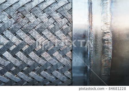 Metal texture with a herringbone pattern of steel. Metal texture with a herringbone pattern of steel. 84681228