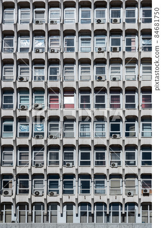 Soviet architecture. Facade of gray building with windows 84681750