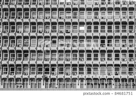 Soviet architecture. Facade of gray building with windows 84681751