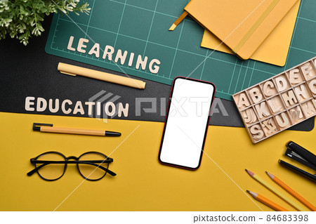 Mock up smart pone with white screen, glasses and stationery on colorful background. 84683398