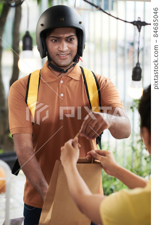 Courier on Scooter Receiving Paper Bag Courier on Scooter Receiving Paper Bag 84685046