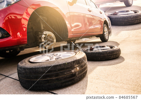 Red car in station repair service car maintenance for industry rubber wheels tire vehicle auto car change garage repairing problem transport automobile service automotive maintenance. 84685567