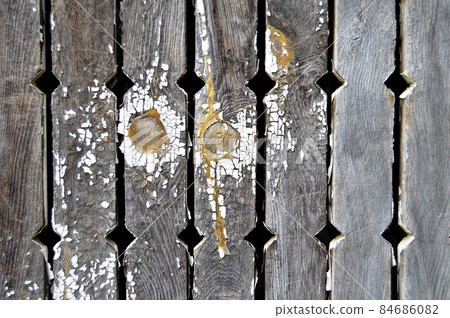Cracked peeled white paint background on old wooden floor, cracked paint pattern Cracked peeled white paint background on old wooden floor, cracked paint pattern 84686082