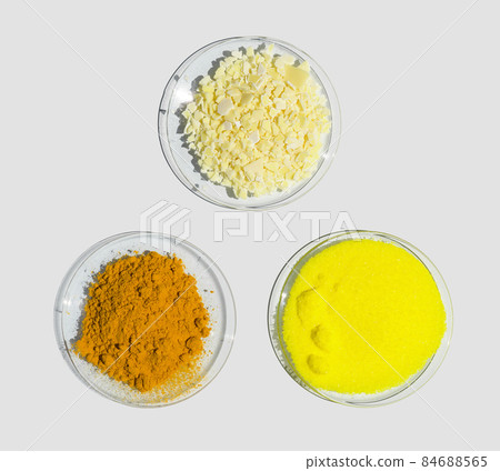 Sodium sulfide flake, Potassium Chromate and Organic Curcuma Powder in Chemical Watch Glass. Closeup chemical ingredient on white laboratory table. Top View 84688565