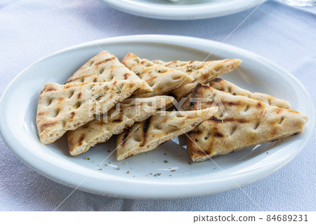 Greek flatbread lagana in Greece. Greek flatbread lagana in Greece. 84689231