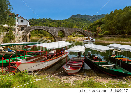 Old Bridge in Rijeka Crnojevica River near Skadar Lake - Montenegro 84689427