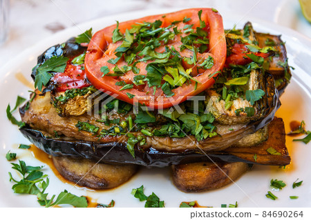Greek dish of fried eggplant, zucchini, tomato and potatoes. 84690264
