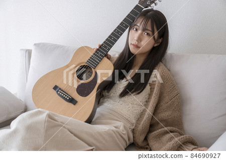 Guitar and female portrait Guitar and female portrait 84690927
