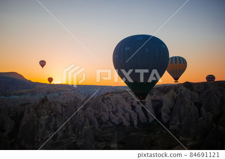 Bright hot air balloons in sky of Cappadocia, Turkey 84691121