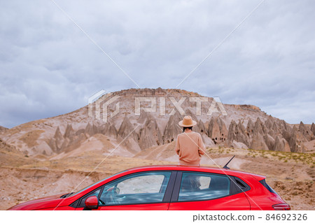 Happy woman on summer vacation in famous place. Cave formations. 84692326