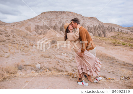 Happy couple on summer vacation in famous place. Cave formations. 84692329