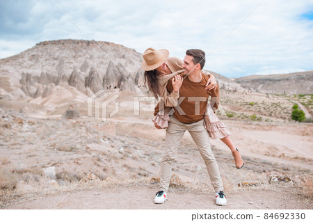 Happy couple on summer vacation in famous place. Cave formations. 84692330