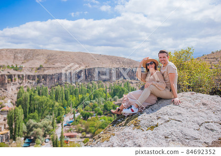 Happy couple on summer vacation in famous place. Cave formations. 84692352