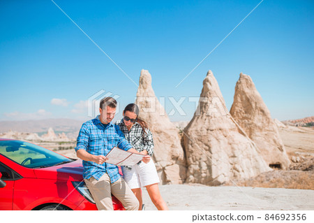 Happy couple on summer vacation in famous place. Cave formations. 84692356