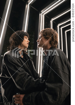 Lovers are cuddling at the street and looking into each other with love and tenderness 84693584