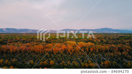 Aerial view of the Apuan Alps mountain range and autumn vegetation. 84694270
