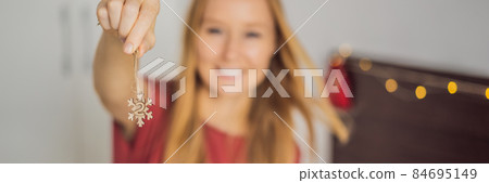 Woman making Christmas advent calendar. Pouches on a rope BANNER, LONG FORMAT 84695149