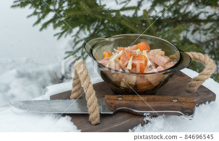 delicious dish of frozen fish. plate of food on the background of a Christmas tree. 84696545