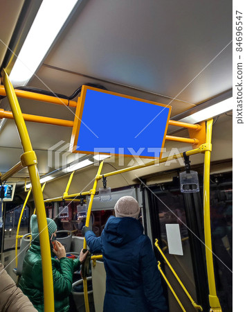 information board in the bus cabin. advertising in public transport. screen on the bus, a place for advertising. 84696547