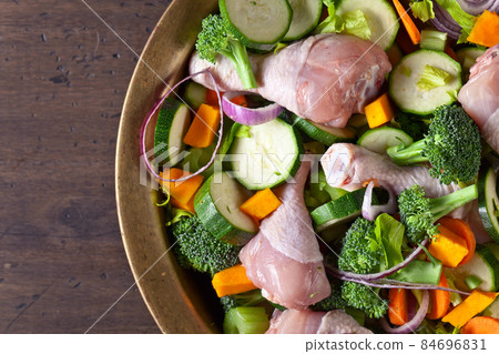 raw vegetables with chicken drumsticks raw vegetables with chicken drumsticks 84696831