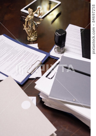Group of objects and several stacks of juridical papers 84697258