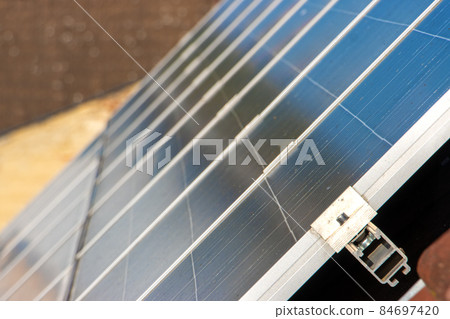 Solar panels on the roof of a house in the city. Solar panels on the roof of a house in the city. 84697420