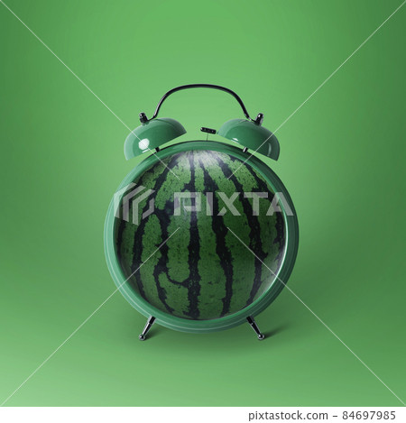 Creative green watermelon alarm clock on a green background. Funny design, concept idea 84697985