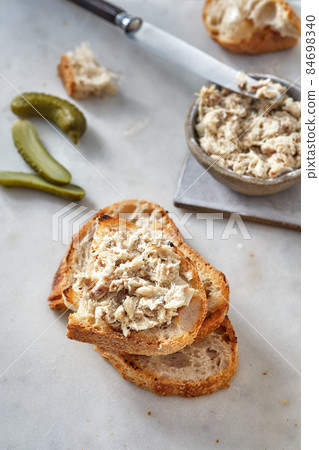 Mackerel Riyette. Mackerel paste on toasts from fried bread Mackerel Riyette. Mackerel paste on toasts from fried bread 84698340