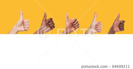 Closeup of male hands showing thumbs up sign gesture Closeup of male hands showing thumbs up sign gesture 84699211