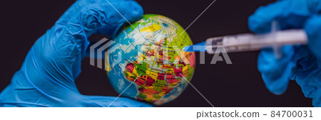 BANNER, LONG FORMAT Syringe vaccinates the globe, on a map of the Europe. Europe Coronavirus, Corona virus attack concept. Europe fight against coronavirus. Concept of fight against coronavirus 84700031