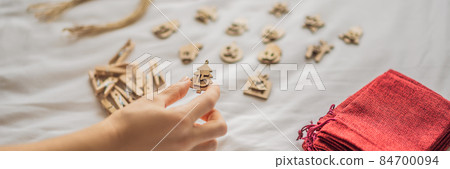 Woman making Christmas advent calendar. Pouches on a rope BANNER, LONG FORMAT 84700094