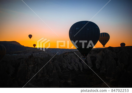 Bright hot air balloons in sky of Cappadocia, Turkey Bright hot air balloons in sky of Cappadocia, Turkey 84702253