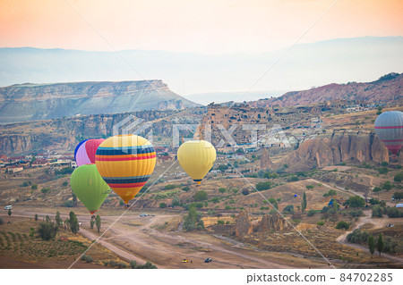 Bright hot air balloons in sky of Cappadocia, Turkey 84702285