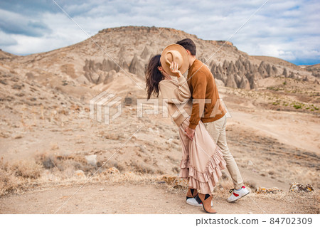 Happy couple on summer vacation in famous place. Cave formations. Happy couple on summer vacation in famous place. Cave formations. 84702309
