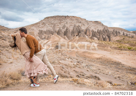 Happy couple on summer vacation in famous place. Cave formations. 84702318