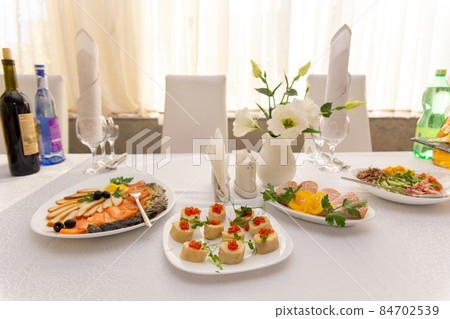Beautiful table served with glassware and cultery, prepared for festive event. Beautiful table served with glassware and cultery, prepared for festive event. 84702539