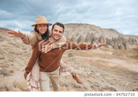 Happy couple on summer vacation in famous place. Cave formations. 84702710
