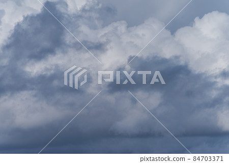 Gray overcast cloudy sky over horizon. Closeup clouds 84703371