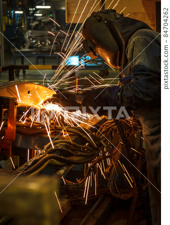Industrial steel welder in factory 84704262